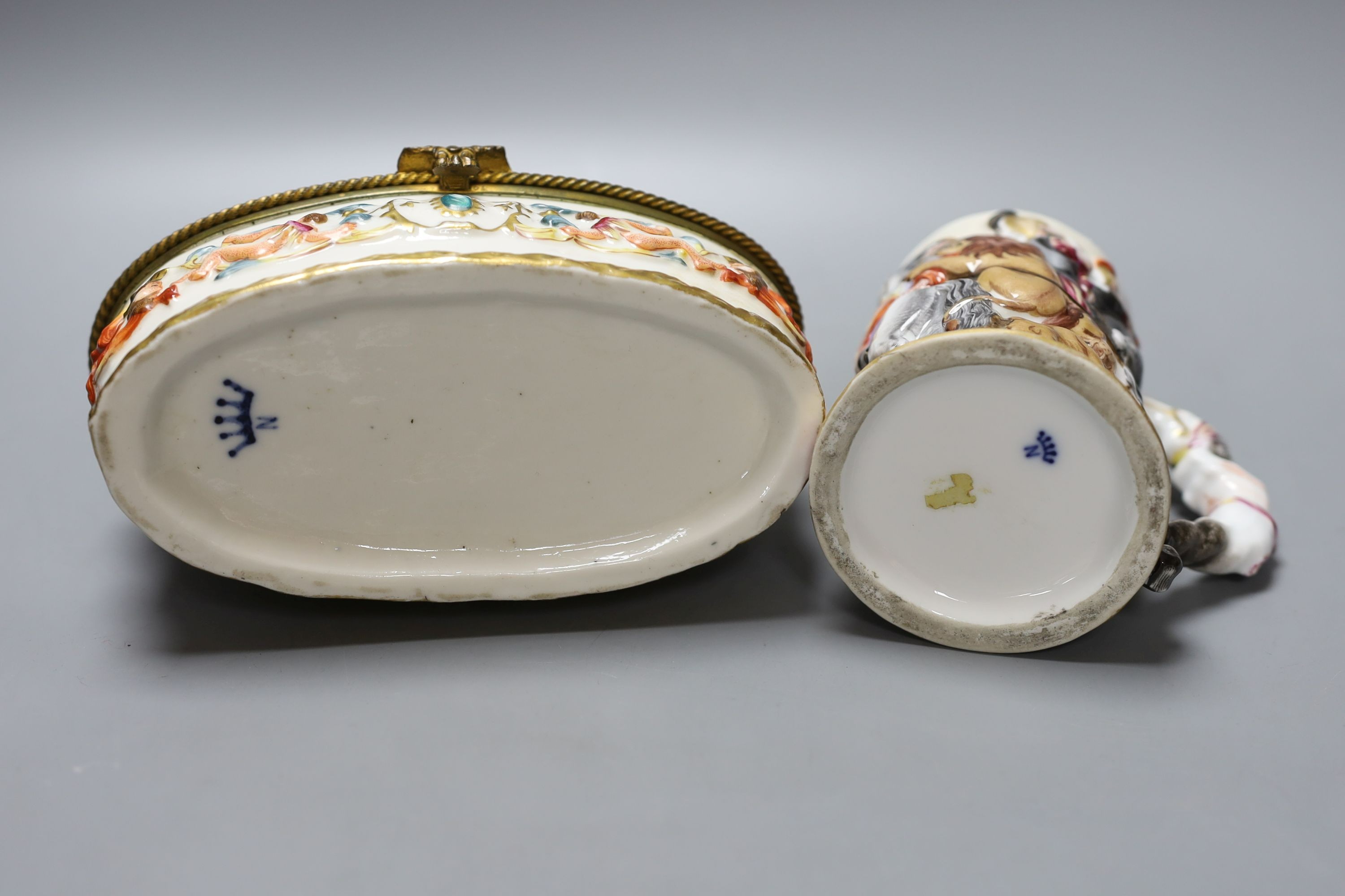 A Doccia style porcelain mug and similar oval casket 18cm